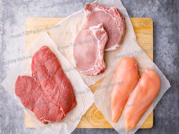 Three kinds of meat packed by meat packaging machine: chicken, beef, pork