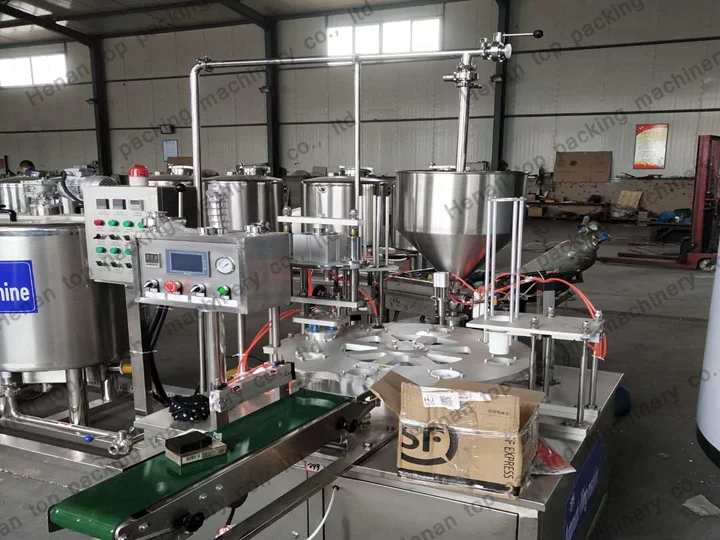 Yogurt cup filling and sealing machine